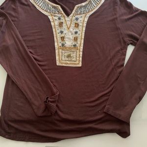 Beaded tee,  says L but it is definitely small.  Well beaded
